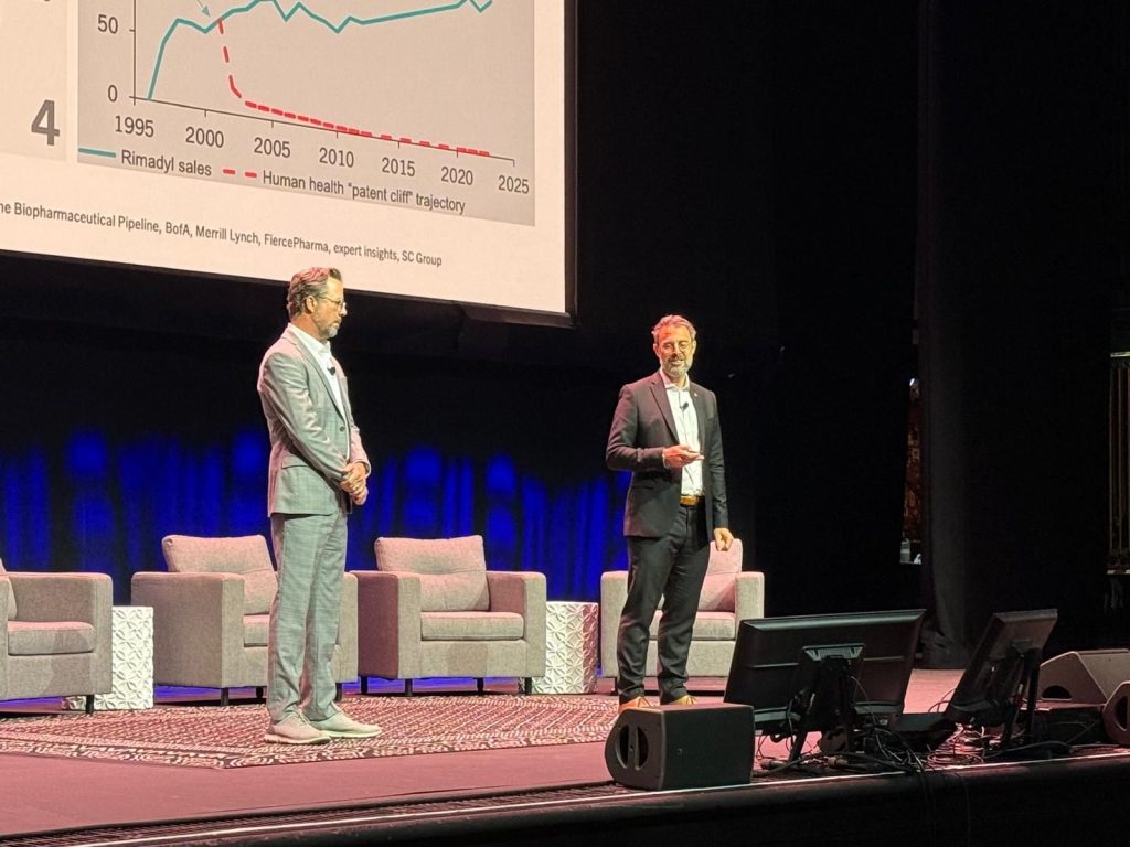 Juerg and Chad presenting on stage at the 2026 Animal Health Summit in Kansas City